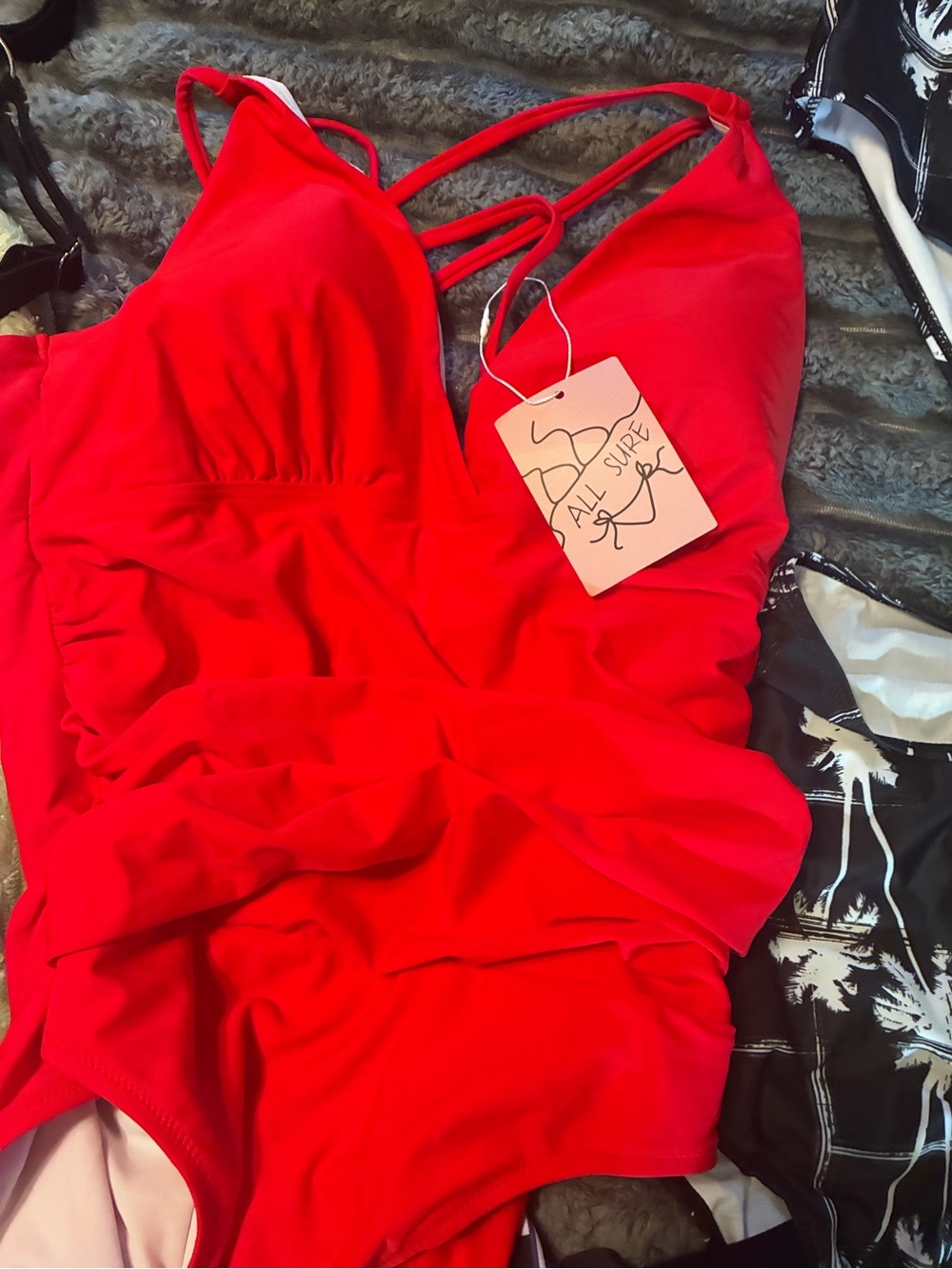 Mystery item each bundle will have five bathing suits and one free wrap